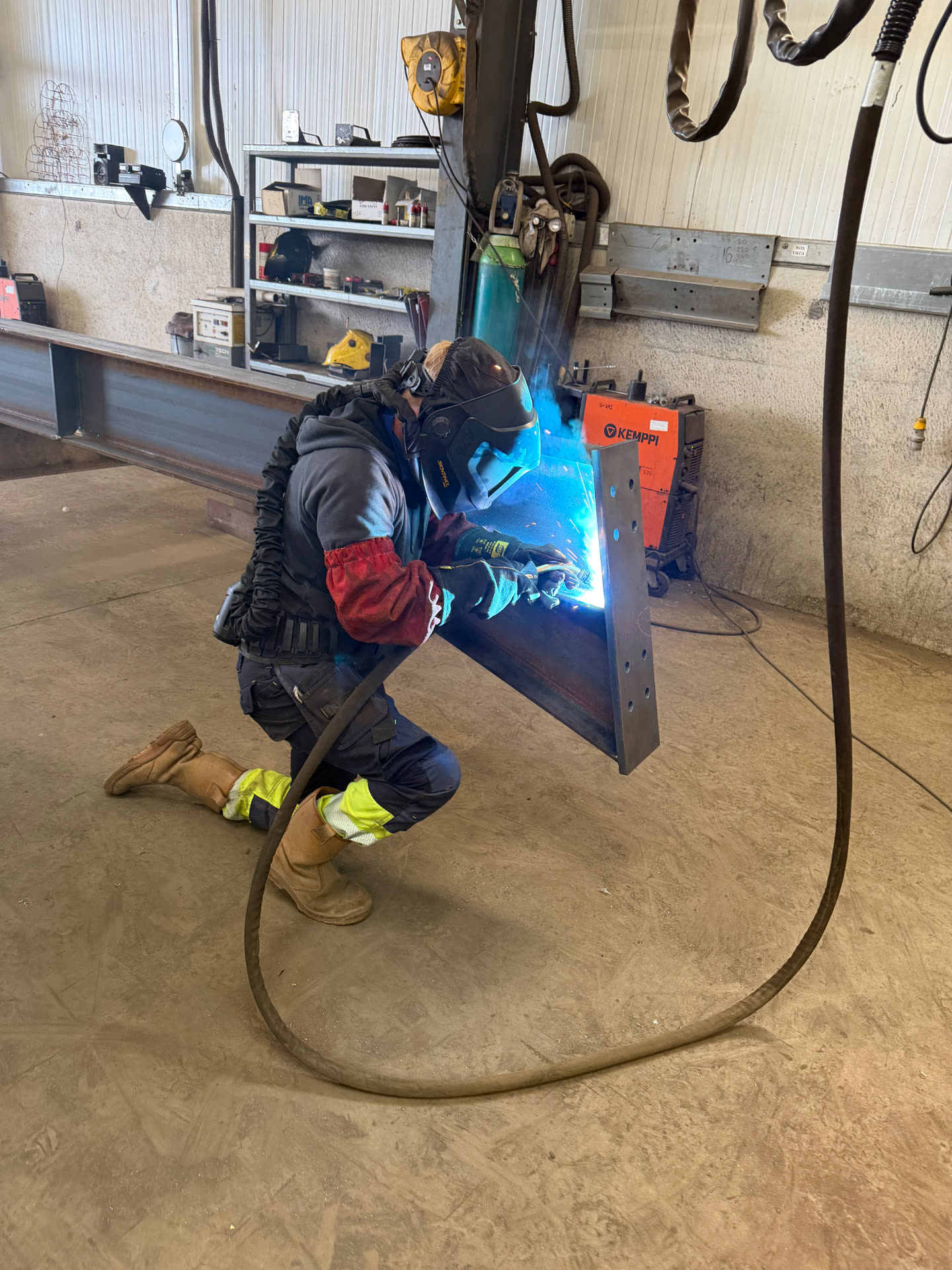 RPD welder fabricating a structural steel beam in the workshop